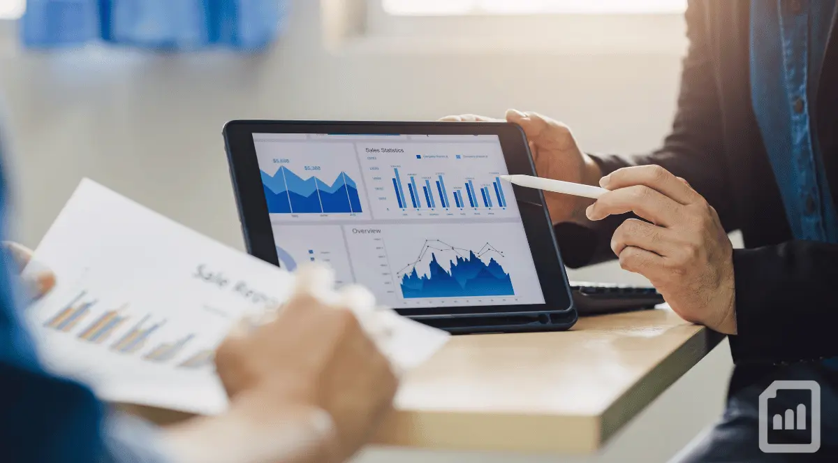 two men looking at cash flow results